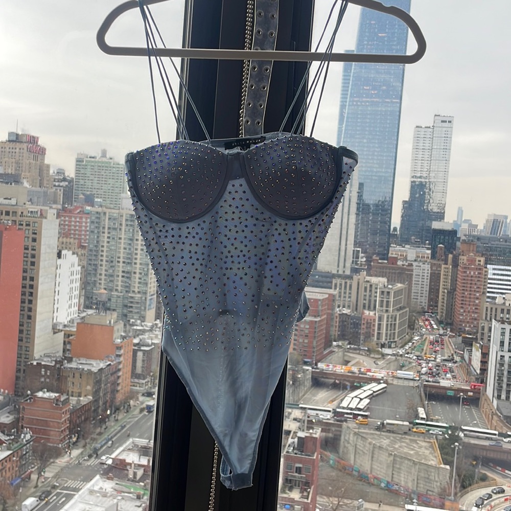 Blue sparkly body suit